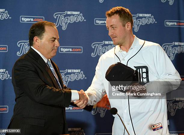 Detroit Tigers Executive Vice President of Baseball Operations and General Manager Al Avila shakes hands with new Tigers pitcher Jordan Zimmermann...