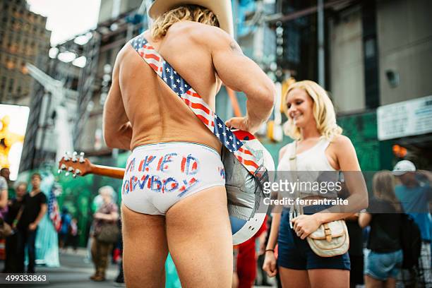 the naked cowboy at times square - broadway bares stock pictures, royalty-free photos & images
