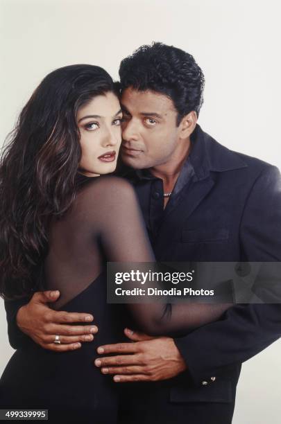 Portrait of Indian film actor Manoj Bajpai and actress Raveena Tandon.