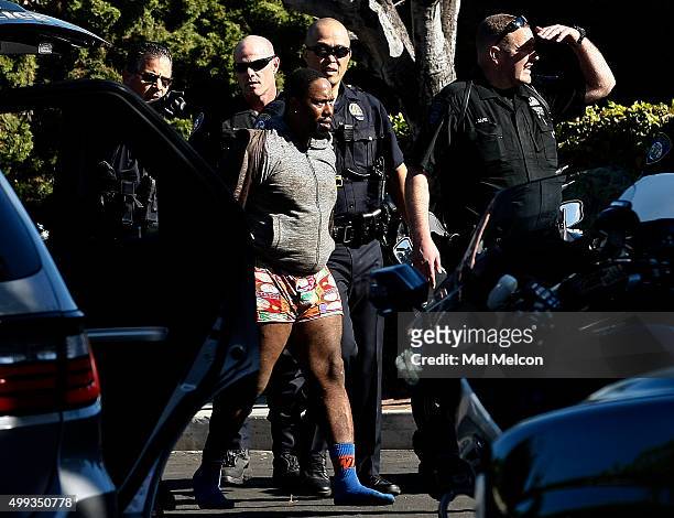 One of two suspects who led police on a car chase, that started in Beverly Hills, is taken into custody by Beverly Hills police officers, after being...