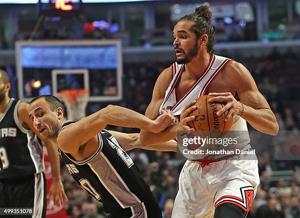 Manu Ginobili of the San Antonio Spurs grabs the jersey of Joakim Noah of the Chicago Bulls at the United Center on November 30, 2015 in Chicago,...