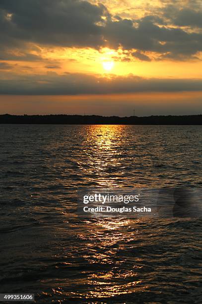 sun setting reflection on the water - springfield ストックフォトと画像