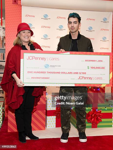 Boys & Girls Clubs of America Regional Development Officer Aimee Hunnewell and singer Joe Jonas attend JCPenney's #GIVETUESDAY with the Queens Boys &...