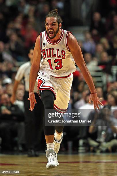 Joakim Noah of the Chicago Bulls celebrates hitting a shot against the San Antonio Spurs at the United Center on November 30, 2015 in Chicago,...