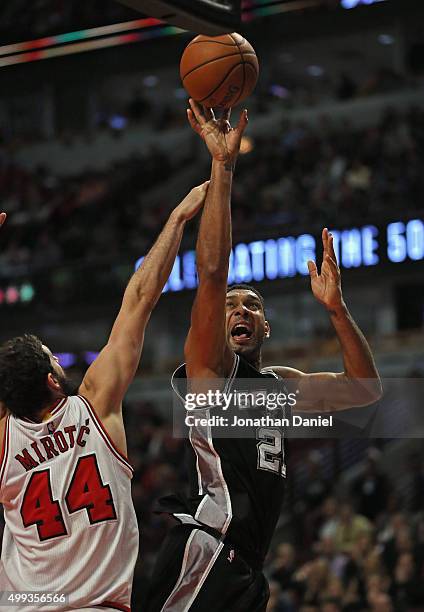 Tim Duncan of the San Antonio Spurs shoots over Nikola Mirotic of the Chicago Bulls at the United Center on November 30, 2015 in Chicago, Illinois....