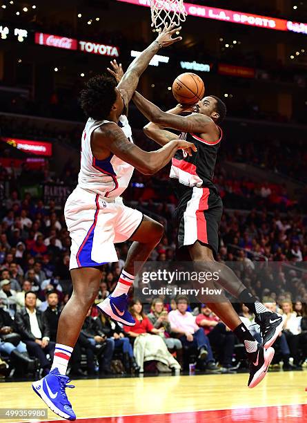 Al-Farouq Aminu of the Portland Trail Blazers has his shot contested by DeAndre Jordan of the Los Angeles Clippers during the first half at Staples...