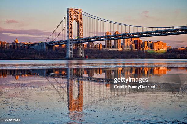 evening sunlight on the george washington bridge - - washington heights imagens e fotografias de stock