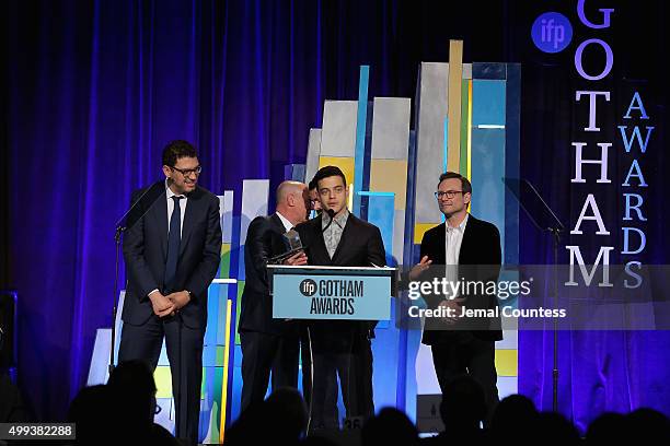 Sam Esmail, Rami Malek, and Christian Slater pose with an award at the 25th IFP Gotham Independent Film Awards co-sponsored by FIJI Water on November...