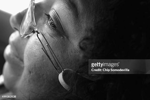 With her broken glasses held on with a paperclip and rubber band, HIV-positive Shana Reynolds-Fairley is driven to a dental appointment May 3, 2013...