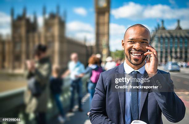 geschäftsmann auf dem telefon in london - international politics stock-fotos und bilder