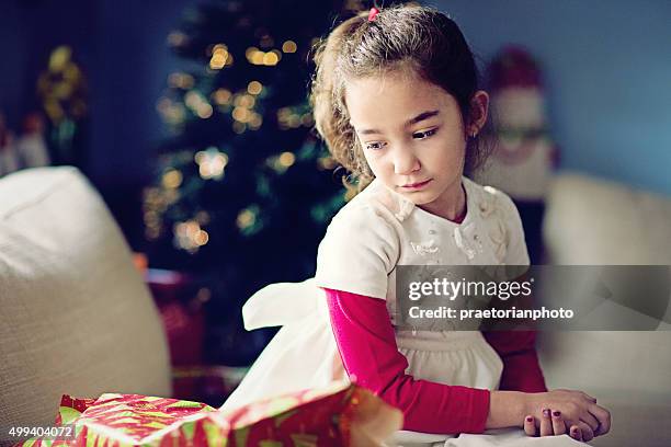 girl at xmas - disappointment gift stock pictures, royalty-free photos & images