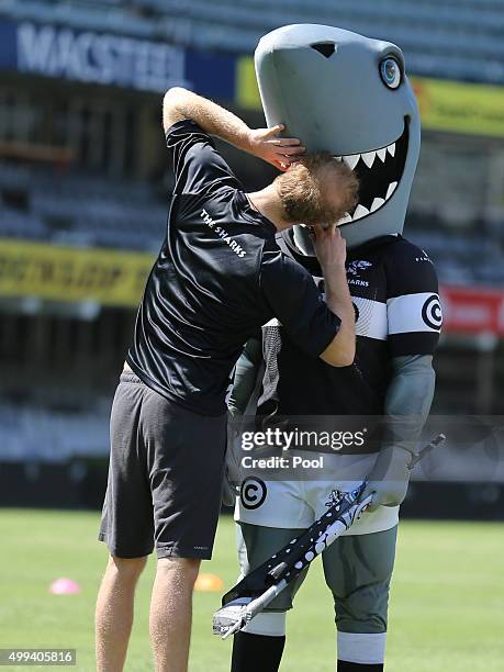 Prince Harry meets the mascot Sharkie as he walks onto the pitch at Kings Park Stadium as he joins members of The Sharks rugby team on the pitch...