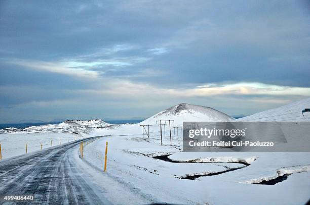 dramatic landscape and winding road near stykkisholmur west iceland - slippery road sign stock pictures, royalty-free photos & images