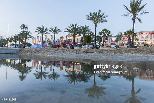 sunset time along promenade of café del mar - café del mar bildbanksfoton och bilder