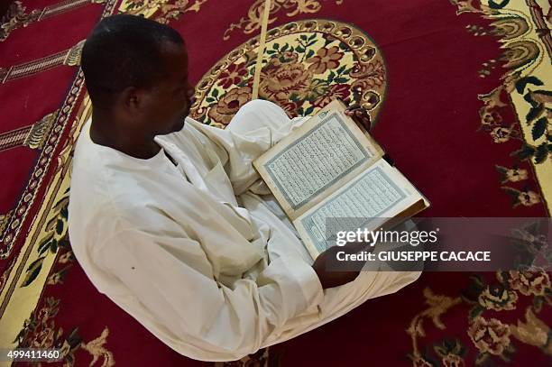 Man sits in Bangui Mosque before the arrival of the Pope Francis for a visit on November 30, 2015 as part of his papal visit to Africa. Pope Francis...