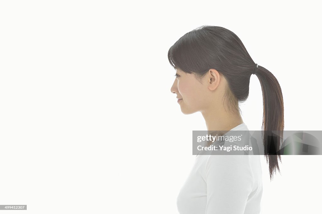 Studio portrait of woman with white background