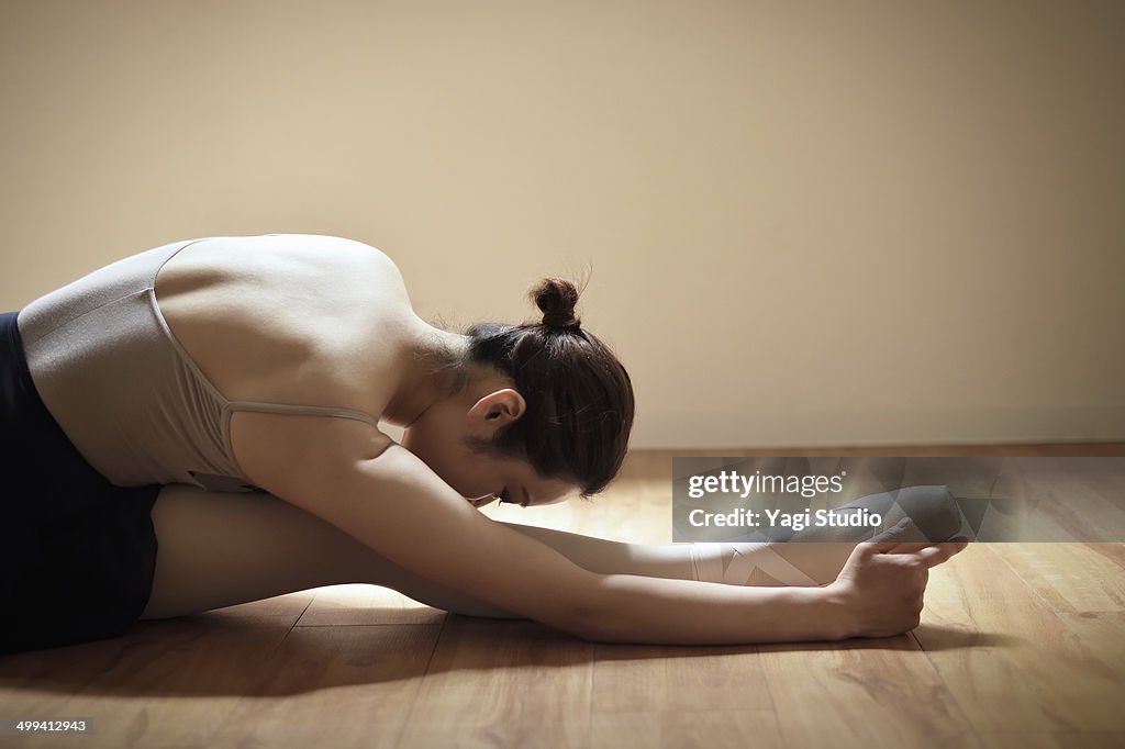 Ballerina exercising in studio