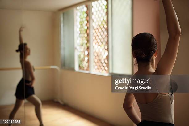 ballerina exercising in studio - practice stock pictures, royalty-free photos & images