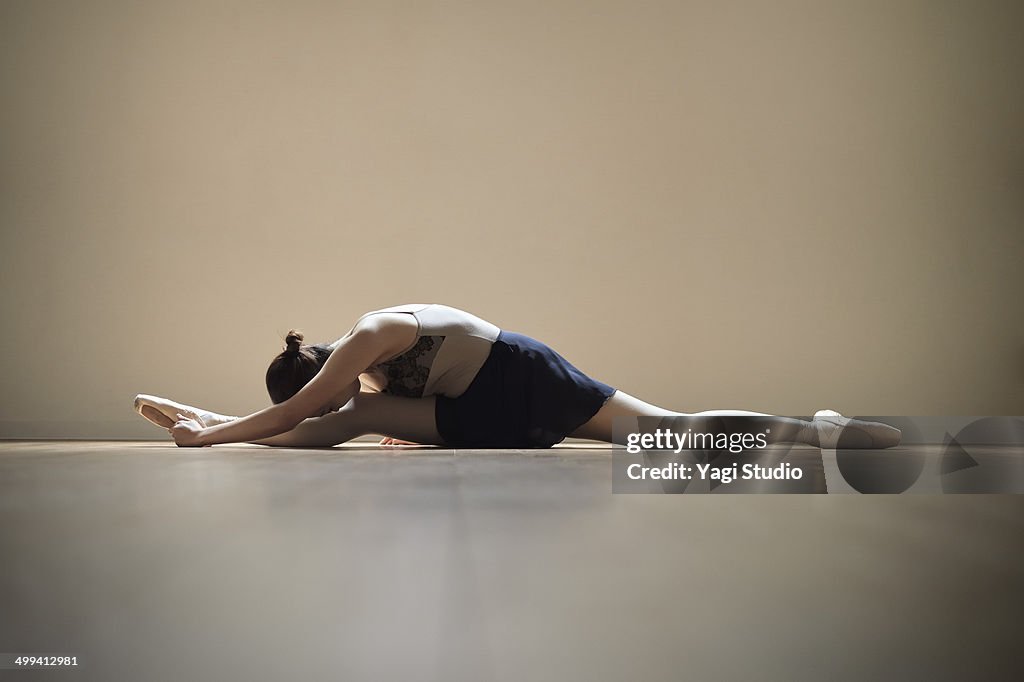 Ballerina exercising in studio