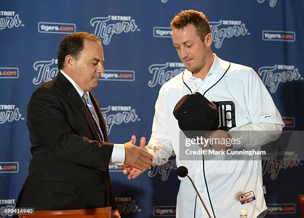 Detroit Tigers Executive Vice President of Baseball Operations and General Manager Al Avila shakes hands with new Tigers pitcher Jordan Zimmermann...