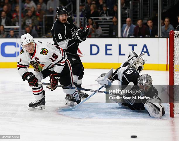 Drew Doughty of the Los Angeles Kings, Jonathan Quick of the Los Angeles Kings defend against a shot by Jonathan Toews of the Chicago Blackhawks...