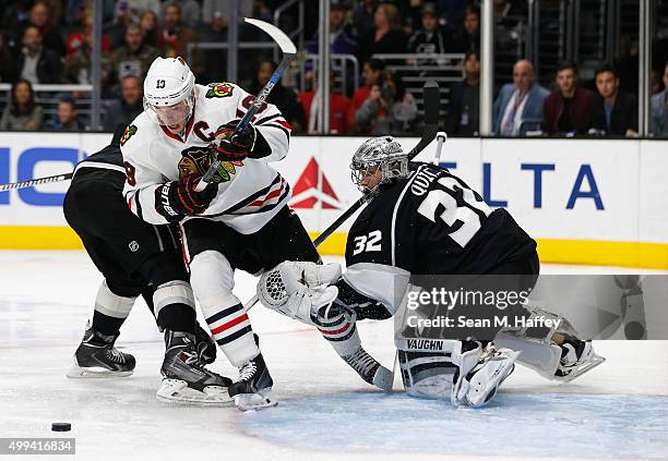 Jonathan Quick of the Los Angeles Kings defends against a shot by Jonathan Toews of the Chicago Blackhawks during a game at Staples Center on...