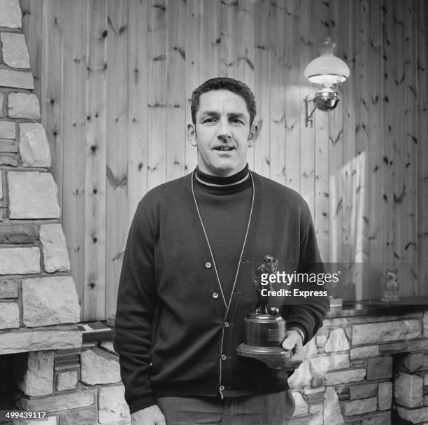 Scottish footballer Dave Mackay of Derby County with his Football Writers' Association's Footballer of the Year award, 10th April 1969. Mackay tied...