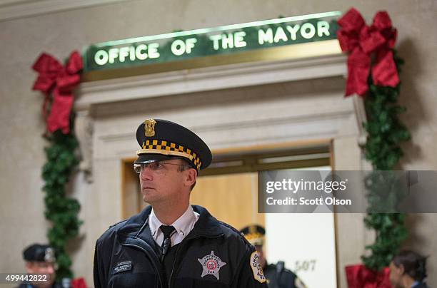 Police guard the office of Mayor Rahm Emanuel at City Hall following press conference where the mayor announced the firing of Chicago Police...