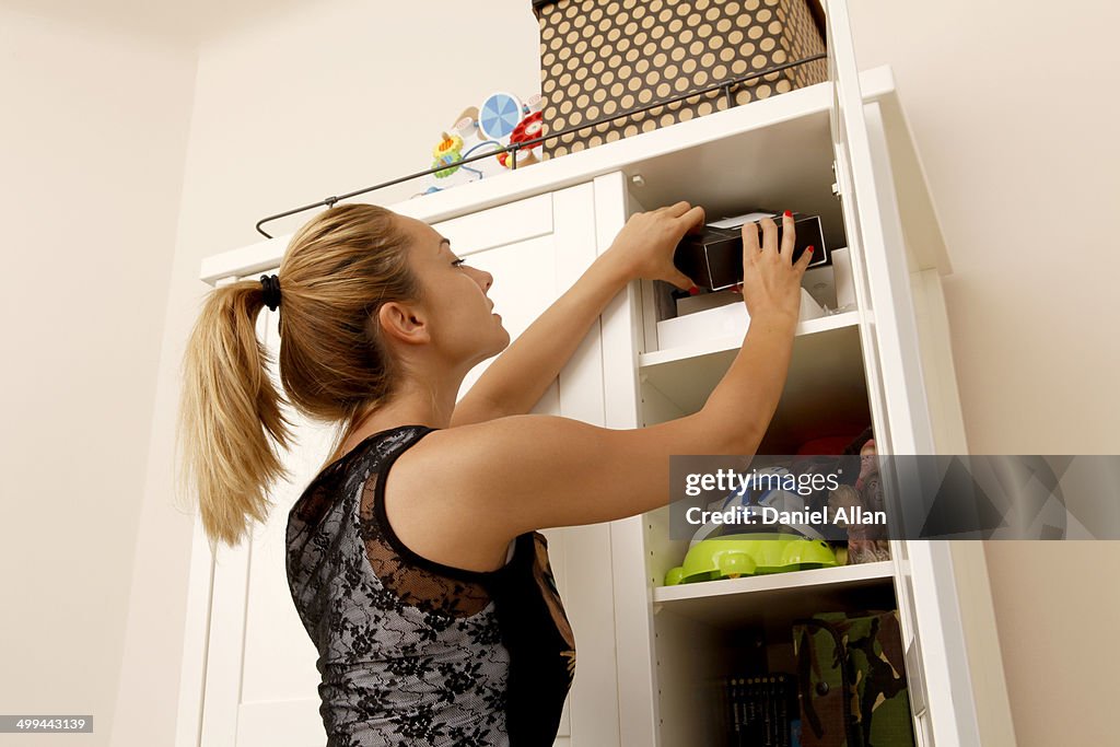 Looking in cupboard