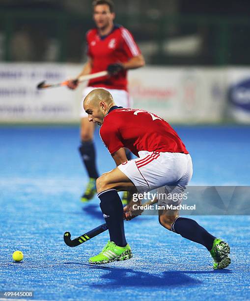 Nick Catlin of Great Britain strikes the ball during the match between Great Britain and Belgium on day five of The Hero Hockey League World Final at...