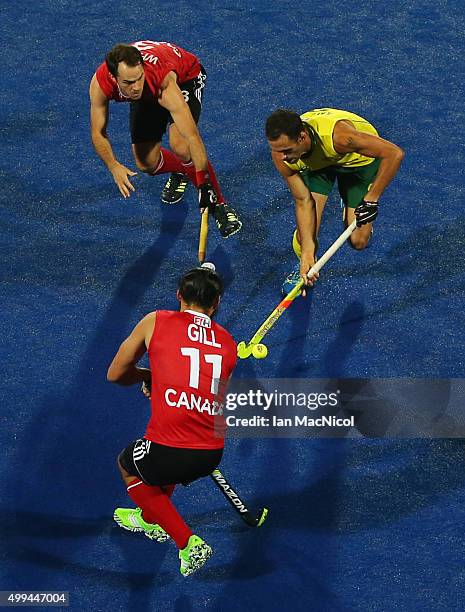 Mark Knowles captain of Australia runs with the ball during the match between Australlia and Canada on day five of The Hero Hockey League World Final...
