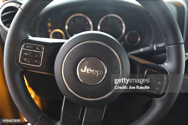Steering wheel of a Jeep Wrangler is seen as the vehicle sits on the sales lot at the Hollywood Chrysler Jeep dealership on December 1, 2015 in...