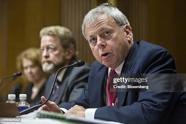 Robert Stack, deputy assistant secretary for international tax affairs at the U.S. Treasury Department, right, speaks during a Senate Finance...