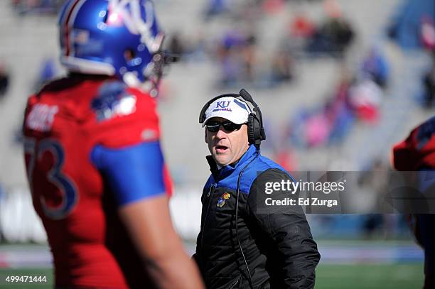 David Beaty head coach of the Kansas Jayhawks walks the sideline against the West Virginia Mountaineers at Memorial Stadium on November 21, 2015 in...