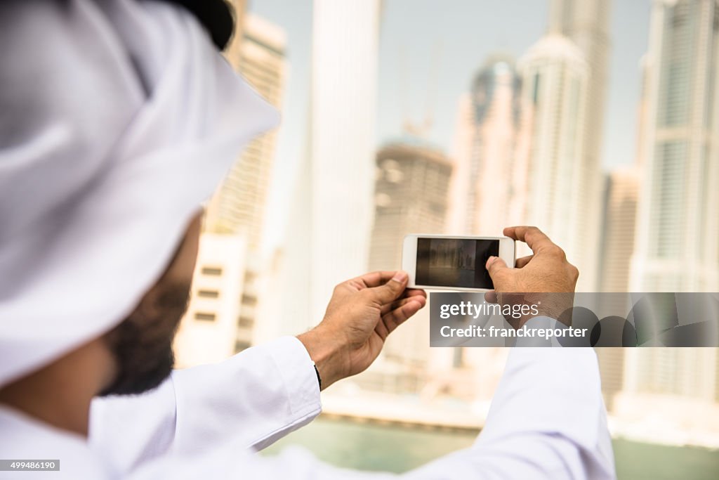 Sheik doing a selfie on dubai marina