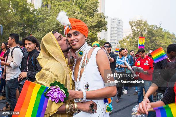 delhi queer pride -2015 - asian lesbians kiss stock pictures, royalty-free photos & images