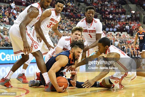 Anthony Gill of the Virginia Cavaliers battles all five Ohio State Buckeyes for control of a loose ball in the first half on December 1, 2015 at...