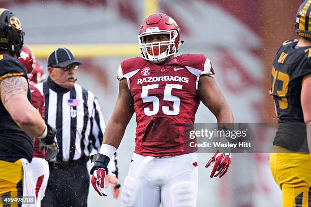 Jeremiah Ledbetter of the Arkansas Razorbacks looks over the offense at the line of scrimmage during a game against the Missouri Tigers at Razorback...