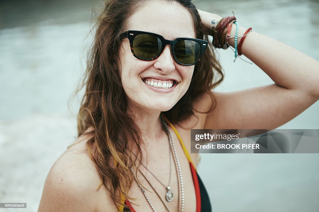 Young woman laughing outside