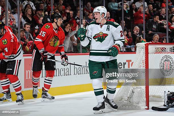 Ryan Suter of the Minnesota Wild reacts after scoring against the Chicago Blackhawks in the third period of the NHL game at the United Center on...