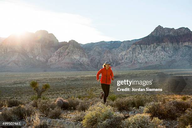 a woman trail running - reserve athlete stock pictures, royalty-free photos & images