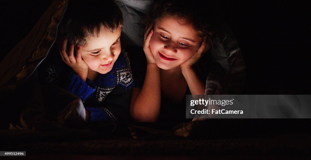 Brother and Sister Watching a Movie