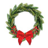 Christmas wreath with bow and red berries.