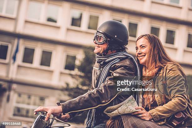 vintage couple with vespa scooter in italy - gorizia stock pictures, royalty-free photos & images