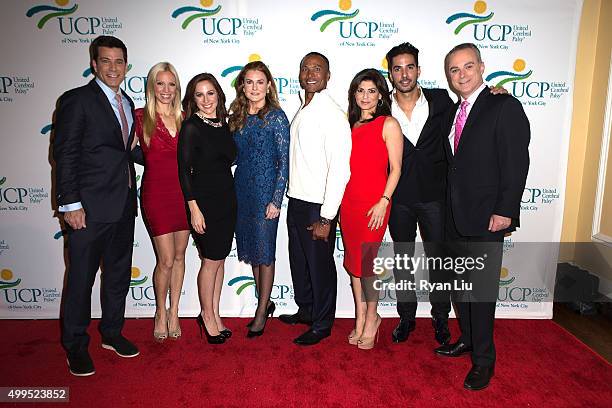 Steve lacy, Liza Hube, Teresa Priolo, Sheila Lennon, Mike Woods, Tamsen Fadal, and Javier Gomez attend the 6th Annual UCP Of NYC Santa Project Party...