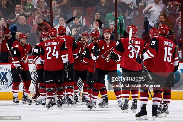 The Arizona Coyotes celebrate after defeating the Ottawa Senators in the NHL game at Gila River Arena on November 28, 2015 in Glendale, Arizona. The...