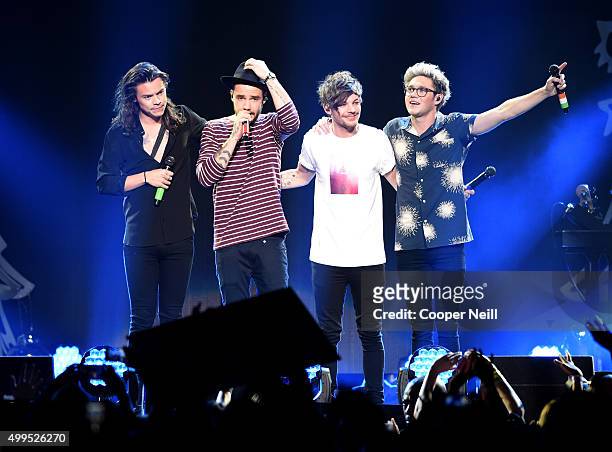 Singer Harry Styles, Liam Payne, Louis Tomlinson, and Niall Horan of One Direction perform onstage during 106.1 KISS FM's Jingle Ball 2015 presented...