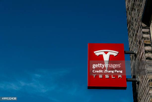 Logo of a Tesla Motors store in Hangzhou downtown. Tesla Motors is an American automotive and energy storage company selling luxury electric cars and...