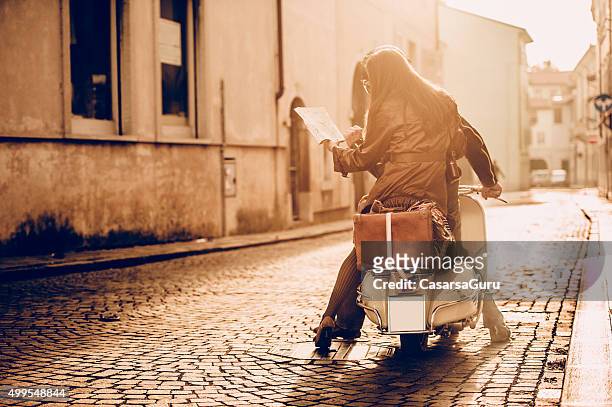 vintage couple with scooter in italy - gorizia stock pictures, royalty-free photos & images
