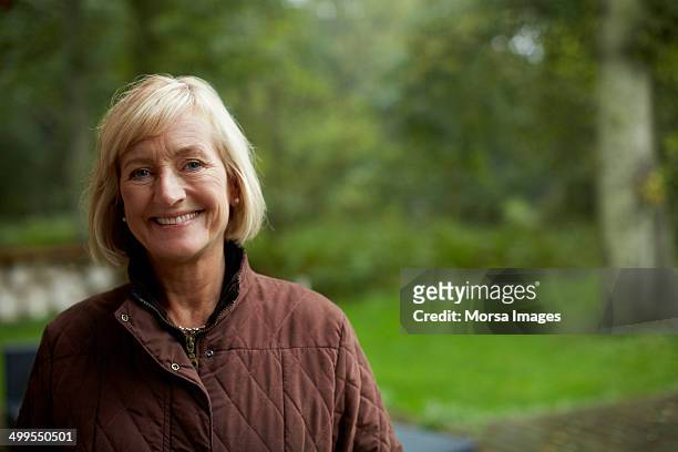 happy senior woman outdoors - 60 64 years stock pictures, royalty-free photos & images